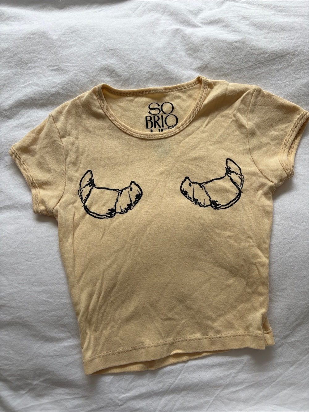 Shop Sobriquet Pale Yellow Croissant Graphic Baby Tee